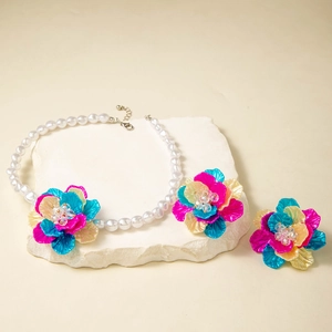 Detailed view of 3D layered flower jewelry set with resin petals and pearl necklace