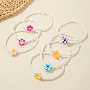 Bohemian white seed bead anklet set featuring colorful resin Plumeria flower charms