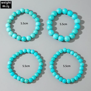 Detail view of 4-piece turquoise bead bracelets showing 5.5cm diameter and stone texture