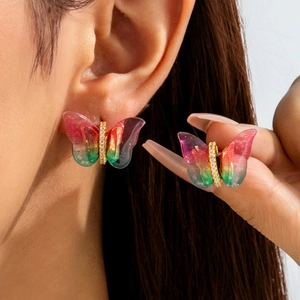 Detailed view of colorful gradient butterfly stud earrings with sparkling crystals