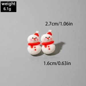 Detail view of cute resin snowman earrings with red hat and dimensions 2.7x1.6cm