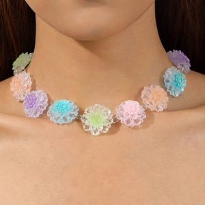 Close-up of colorful resin flower necklace in pastel macaron tones with glitter centers