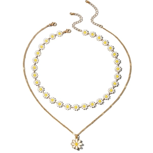 Double-layered gold chain necklace featuring delicate white daisy floral pendants