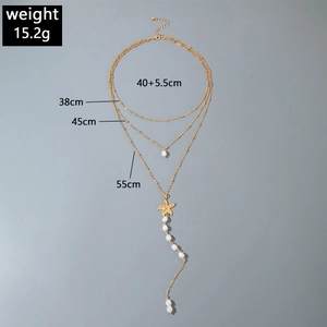 Detail showing multi-layer gold necklace with starfish pendant and length specifications