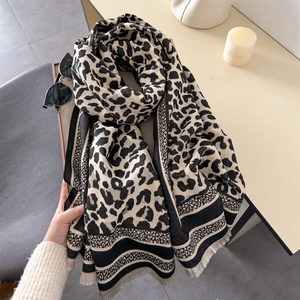 Thick cashmere-like leopard print scarf with tassels for winter warmth and styling