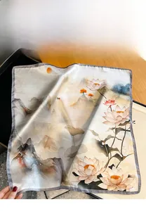 Detail of silk square scarf featuring traditional lotus and landscape floral printing