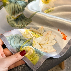 Elegant silk scarf featuring lotus and koi fish patterns on a silver grey background