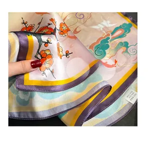 Detail of 100% mulberry silk scarf featuring Dunhuang plum blossom and rolled edges