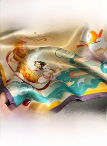 Close-up of Dunhuang silk scarf with champagne base, floral patterns and purple edges
