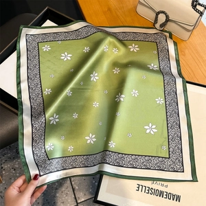 Elegant green silk-like square scarf with white flower patterns and floral border