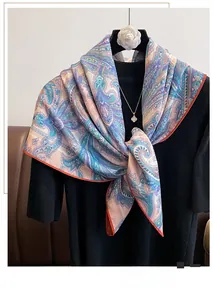Close-up of multi-color paisley pattern scarf with elegant silk texture and detail
