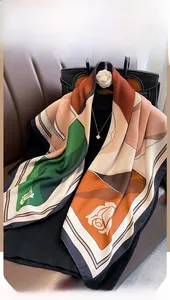 Detail of a large square scarf featuring abstract geometric color blocks and floral prints