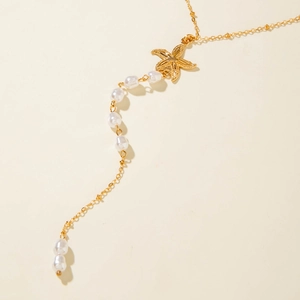 Golden starfish Y-shaped necklace with layered pearls in a bohemian beach style
