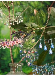 Detailed view of fairy lights and floral PET stickers applied on decorative branches