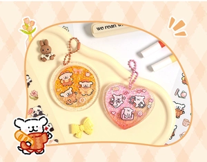 Detail of cute acrylic liquid glitter charms with cartoon dogs and colorful bead chains
