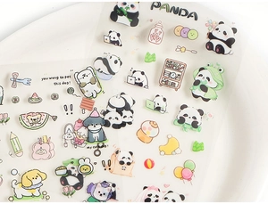 Macro detail of transparent PET panda stickers showing fine printing quality on white ceramic