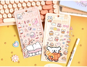 Close-up of cute cartoon puppy and kitten sticker sets for planners on a yellow background
