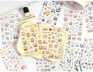 Flat lay of cute cartoon animal stickers for journaling with aesthetic stationery props