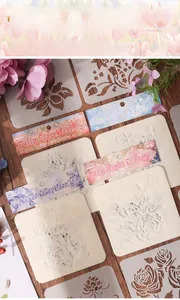 Macro view of six floral stencil sheets including tulip and rose for DIY painting
