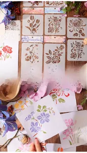 Detailed view of reusable floral painting stencils featuring roses and tulips