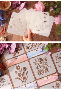 Close-up of 6-pack floral painting stencils including roses and tulips on wood surface