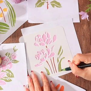 Floral stencil template for DIY painting with green marker on wooden background