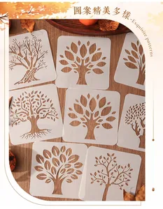Détail de divers pochoirs d'arbres creux sur fond en bois pour les loisirs créatifs DIY