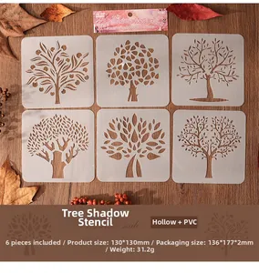 Détail de l'ensemble de 6 pochoirs à motifs d'arbres en PET sur un fond de bois naturel