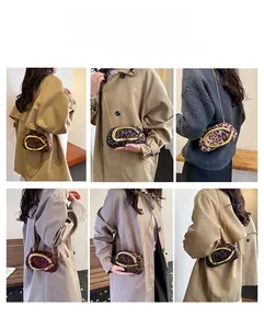 Detail showing various ways to carry the leopard print suede clutch with golden handle