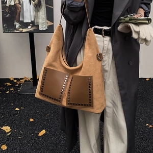 Vintage camel suede shoulder bag with rivet accents and large capacity tote design