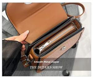 Détail de l'intérieur multicouche et de la fermeture éclair fluide du sac de selle marron