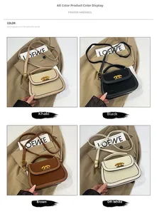 Detail view of vintage saddle bag in khaki, black, brown, and cream with gold hardware