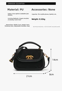 Detail view of black woven PU leather saddle bag with dimensions and gold buckle