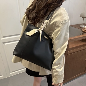 Classic black PU leather tote bag with vintage scarf accent on shoulder strap