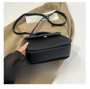 Detail shot of the reinforced wear-resistant base on a black leather saddle bag
