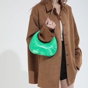 Chic green marble patterned acrylic handbag with chain strap styled for modern women