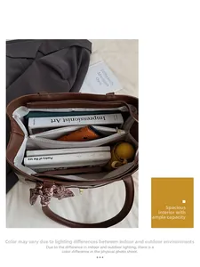 Detail view of large tote interior with zipper compartment and ample storage space