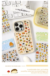 Macro detail of DIY cream iPhone case decorated with cute cat and animal PET stickers