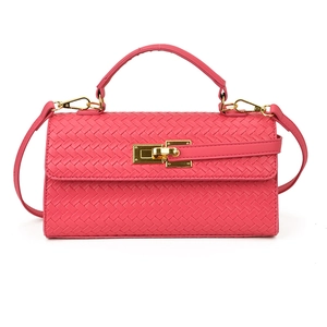 Magenta woven textured small square crossbody bag with gold metal hardware and top handle