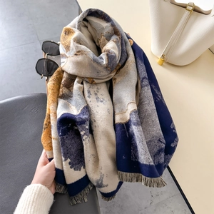 Elegant thick long shawl with blue and yellow jacquard pattern and fringe details