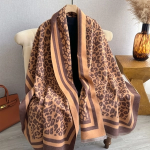 Classic leopard print shawl for women in warm brown tones with elegant fringe edges