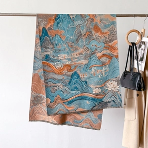 Detail of jacquard scarf with oriental landscape patterns and delicate fringe tassels