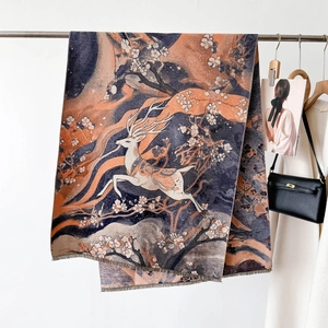 Macro view of Dunhuang style deer and floral jacquard weave on thick winter scarf
