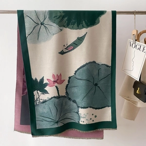 Detail of artistic oil painting scarf with ink lotus motifs and elegant silk texture