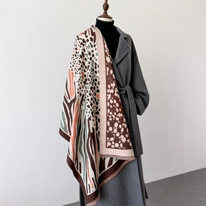 Thick leopard print cashmere shawl with fringe tassels and abstract geometric patterns