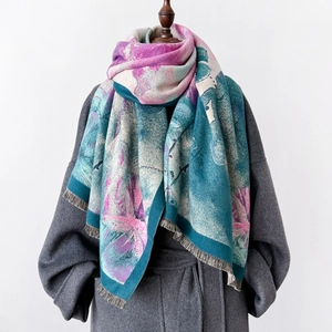 Thick warm winter scarf with floral art print and fringe paired with grey wool coat