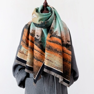 Artistic oil painting style scarf with tassels shown on a mannequin over a grey coat