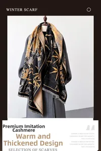 Detail of winter thick scarf featuring artistic leaf pattern and fringe on gray coat
