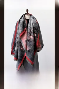 Detail view of the fringe tassels and traditional Chinese painting print on winter scarf