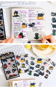 Détail d'autocollants de chats noirs pour scrapbooking avec finition transparente